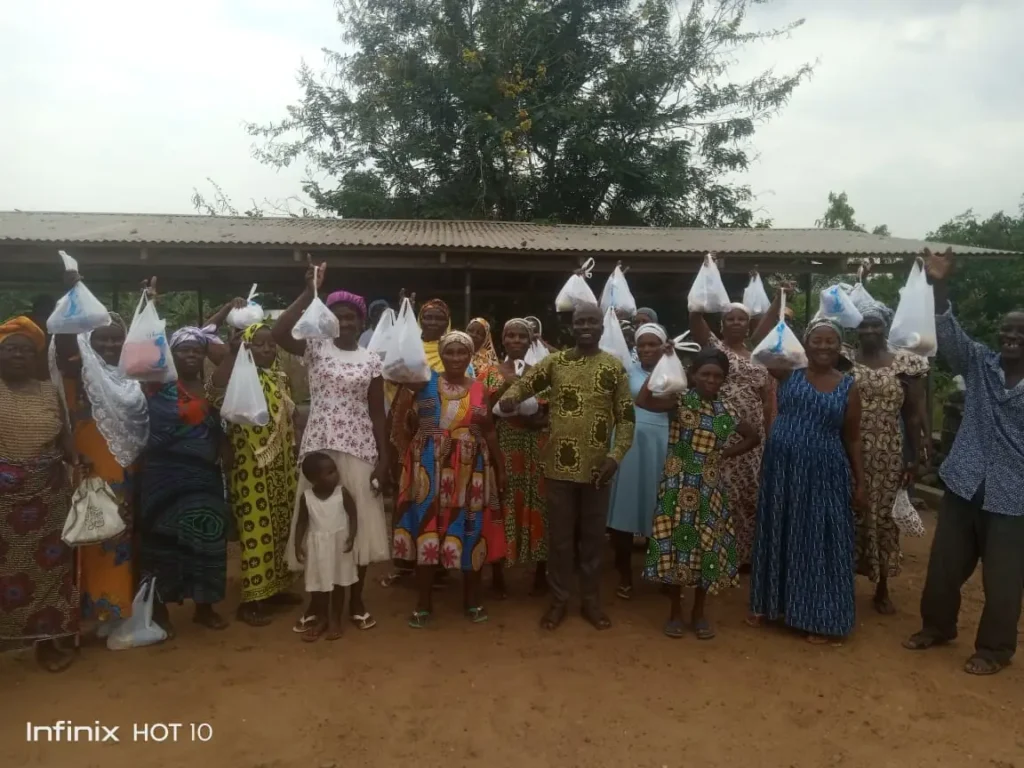 Widows in Asutuare receiving empowerment parcels from Living the Dream Foundation.