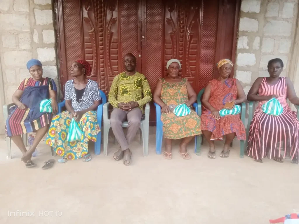 Ayenya widows showing parcels received from Living the Dream Foundation.